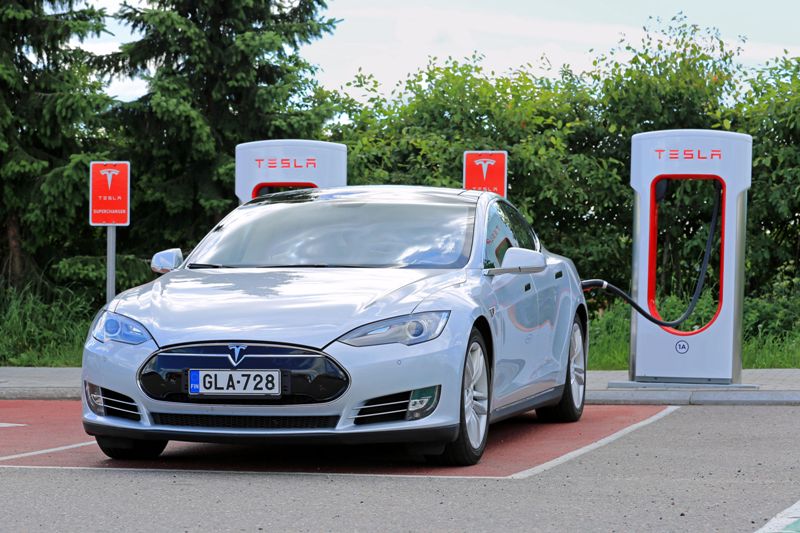 Tesla Model S being charged at Tesla Supercharger station